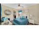 Bedroom boasts seaside-inspired decor and a decorative, reflective wall hanging at 1228 Castle Pines Ct, Reunion, FL 34747