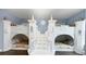 Unique castle-themed bunk beds with staircase and charming architectural details in this fun bedroom at 1228 Castle Pines Ct, Reunion, FL 34747