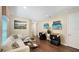 Open game room featuring a comfortable white sofa, golf themed wall decor, and arcade games at 1228 Castle Pines Ct, Reunion, FL 34747