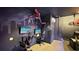 Gaming room featuring dual monitors, gaming chairs, and decor at 1228 Castle Pines Ct, Reunion, FL 34747