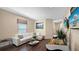 Game room featuring a comfortable white sofa, golf-themed wall decor, and arcade games on a wood floor at 1228 Castle Pines Ct, Reunion, FL 34747