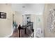 Upstairs hallway with decorative art pieces and staircase at 1228 Castle Pines Ct, Reunion, FL 34747
