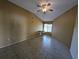 Comfortable bedroom features natural light, neutral colors, and tiled floors at 13940 Corrine Key Pl, Orlando, FL 32824