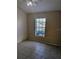 This bedroom offers natural light from the window and neutral flooring at 13940 Corrine Key Pl, Orlando, FL 32824