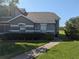 Charming single-Gathering home featuring a well-maintained lawn and lush landscaping at 13940 Corrine Key Pl, Orlando, FL 32824