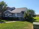 Charming home exterior with well-manicured lawn, mature trees, and a neatly trimmed shrubbery at 13940 Corrine Key Pl, Orlando, FL 32824