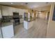 Modern kitchen with stainless appliances, granite counters, breakfast bar, and tile backsplash at 13940 Corrine Key Pl, Orlando, FL 32824