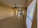 The open-concept living room features tiled floors and natural light at 13940 Corrine Key Pl, Orlando, FL 32824
