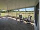 Enclosed patio with tiled floors, offering a tranquil retreat with views of the surrounding landscape at 13940 Corrine Key Pl, Orlando, FL 32824