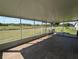 Enclosed back patio with scenic views, perfect for outdoor relaxation and enjoyment at 13940 Corrine Key Pl, Orlando, FL 32824