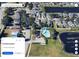 An aerial view showing a neighborhood featuring homes, a playground, and a community pool at 1425 Carey Glen Cir, Orlando, FL 32824