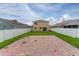Backyard featuring a large brick area and well-maintained white fence at 1425 Carey Glen Cir, Orlando, FL 32824