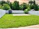 Backyard featuring a white fence and storage shed at 1425 Carey Glen Cir, Orlando, FL 32824