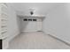 Spacious finished basement with light wood-look flooring, white walls, and shelving unit at 1425 Carey Glen Cir, Orlando, FL 32824