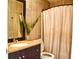 Bathroom with tiled walls, granite countertop, and shower with curtain at 1425 Carey Glen Cir, Orlando, FL 32824