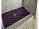 Walk-in shower with a dark tile floor and marble tiled walls at 1425 Carey Glen Cir, Orlando, FL 32824