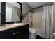 Stylish bathroom featuring a shower-tub combo and black cabinets at 1425 Carey Glen Cir, Orlando, FL 32824