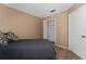 Neutral bedroom featuring wood floors and an open closet at 1425 Carey Glen Cir, Orlando, FL 32824