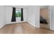 Bright bedroom with hardwood floors, a large window, and neutral paint at 1425 Carey Glen Cir, Orlando, FL 32824
