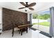 Dining room with decorative brick wall and sliding door to the backyard at 1425 Carey Glen Cir, Orlando, FL 32824