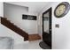 Inviting entryway featuring tile flooring, staircase, and a front door with glass inserts at 1425 Carey Glen Cir, Orlando, FL 32824