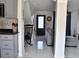 Open concept entryway, stylish tile floor and rocking chair by the staircase at 1425 Carey Glen Cir, Orlando, FL 32824