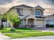 Two-story home with a well-manicured lawn and attached garage at 1425 Carey Glen Cir, Orlando, FL 32824