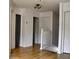 Upstairs hallway with wood floors, white trim, and natural light at 1425 Carey Glen Cir, Orlando, FL 32824