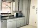 Modern kitchen with stainless steel sink and ample cabinet space at 1425 Carey Glen Cir, Orlando, FL 32824