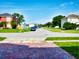 Residential street with well-kept lawns and various home styles at 1425 Carey Glen Cir, Orlando, FL 32824