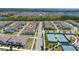 Aerial view of the property with neighborhood, showing proximity to tennis courts at 14309 Lanikai Beach Dr, Orlando, FL 32827