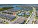 Aerial view of the property with neighborhood, community amenities and lake views at 14309 Lanikai Beach Dr, Orlando, FL 32827