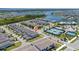 Aerial view of the property with neighborhood, community amenities and lake views at 14309 Lanikai Beach Dr, Orlando, FL 32827