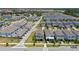 Aerial view of the property with neighborhood, showing streetscape at 14309 Lanikai Beach Dr, Orlando, FL 32827