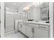 Contemporary bathroom with double vanity, glass shower, and modern fixtures at 14309 Lanikai Beach Dr, Orlando, FL 32827