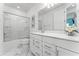 Modern bathroom with a glass-enclosed shower and a white vanity with ample storage at 14309 Lanikai Beach Dr, Orlando, FL 32827