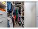 Walk-in closet with custom shelving and organizational features for clothing and shoes at 14309 Lanikai Beach Dr, Orlando, FL 32827