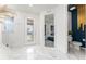Welcoming entryway with marble flooring, a stylish door, and a view of a bedroom and bathroom at 14309 Lanikai Beach Dr, Orlando, FL 32827