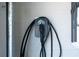 Close up of an electric car charging station mounted on a garage wall at 14309 Lanikai Beach Dr, Orlando, FL 32827