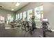 Well-equipped gym with treadmills, elliptical machines, and large windows offering scenic views at 14309 Lanikai Beach Dr, Orlando, FL 32827
