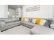 Cozy living room with a large sectional sofa and decorative pillows at 14309 Lanikai Beach Dr, Orlando, FL 32827