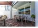Relaxing outdoor space with dining table and chairs for entertaining under the patio at 14309 Lanikai Beach Dr, Orlando, FL 32827