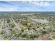 Scenic aerial shot showcasing a well-maintained residential area with a lake and beautiful blue sky overhead at 1436 Nolton Way, Orlando, FL 32822