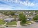 A picturesque aerial view of a well-maintained neighborhood with lush green lawns and mature trees at 1436 Nolton Way, Orlando, FL 32822