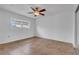 Spacious bedroom featuring tile flooring, a ceiling fan, and a window for natural light at 1436 Nolton Way, Orlando, FL 32822