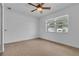 Bright bedroom featuring tile flooring, a ceiling fan, and a window offering natural light at 1436 Nolton Way, Orlando, FL 32822