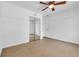 Bedroom featuring tile floors, a ceiling fan, and mirrored closet doors at 1436 Nolton Way, Orlando, FL 32822