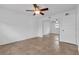 A spacious bedroom with mirrored closet doors, ceiling fan, and tile flooring at 1436 Nolton Way, Orlando, FL 32822
