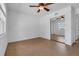 Bedroom featuring tile floors, a ceiling fan, and mirrored closet doors at 1436 Nolton Way, Orlando, FL 32822