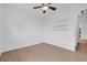 This bedroom has neutral walls, tile floors, a ceiling fan, and three shelves at 1436 Nolton Way, Orlando, FL 32822